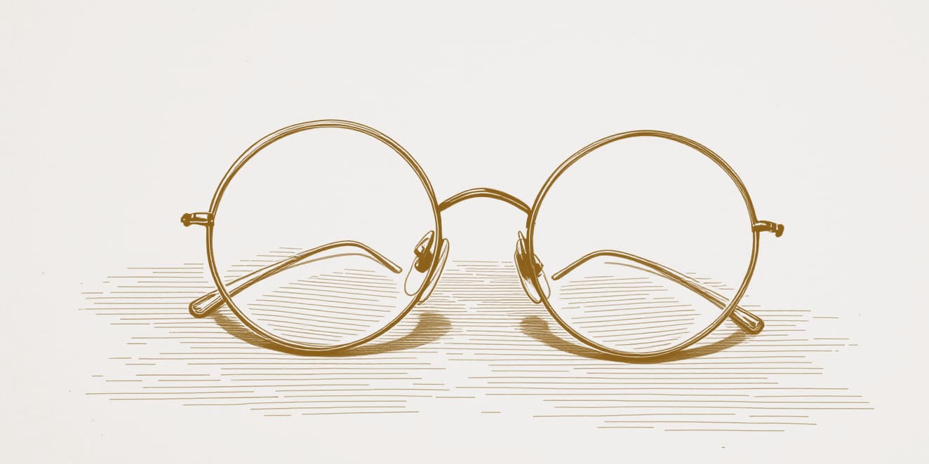 A drawing of a pair of round wire-rimmed spectacles, in gold line on pale paper.